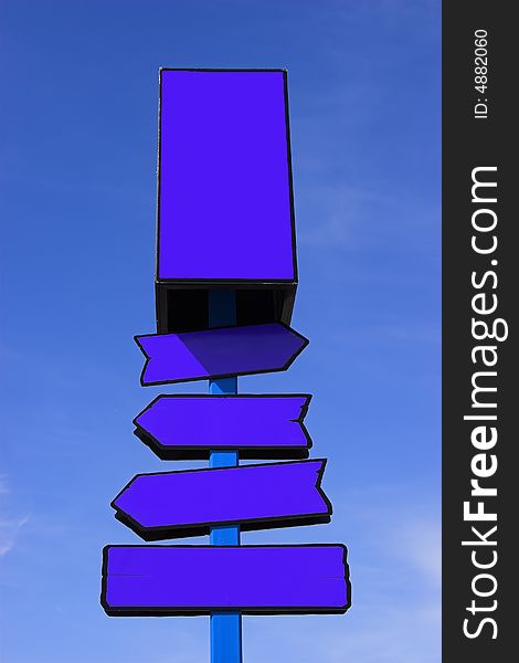Blue directional signpost against a blue sky. Place your signs/logos. Blue directional signpost against a blue sky. Place your signs/logos.