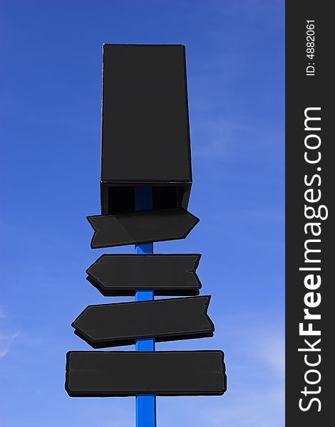 Black directional signpost against a blue sky. Place your signs/logos. Black directional signpost against a blue sky. Place your signs/logos.