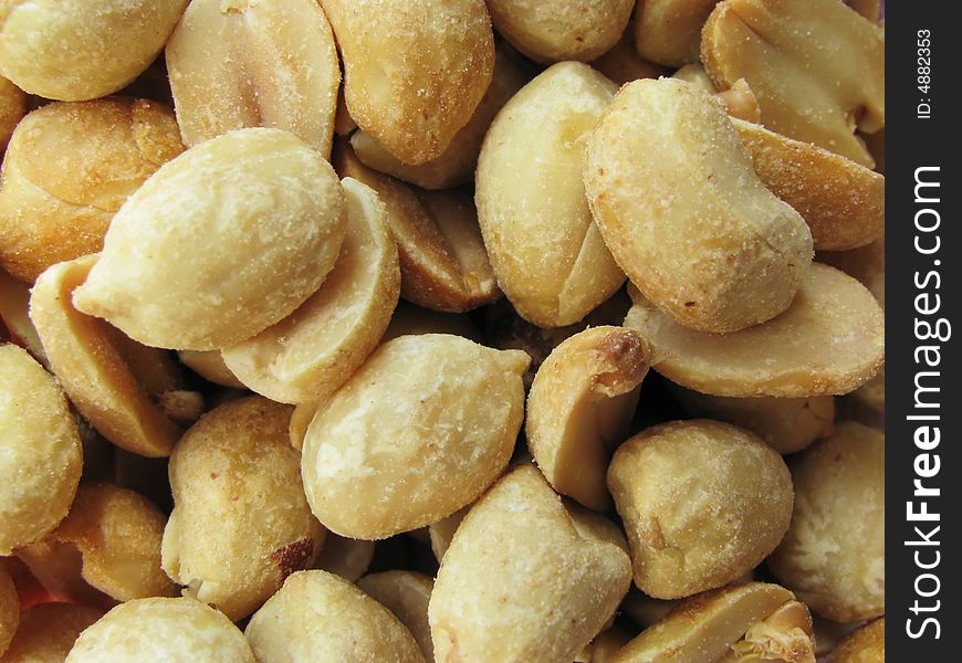 Batch of lightly salted roasted peanuts without shells. Batch of lightly salted roasted peanuts without shells