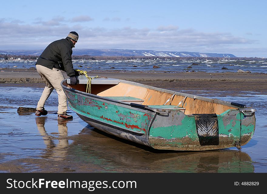 Spring Storms Beach A Fishing Boat.