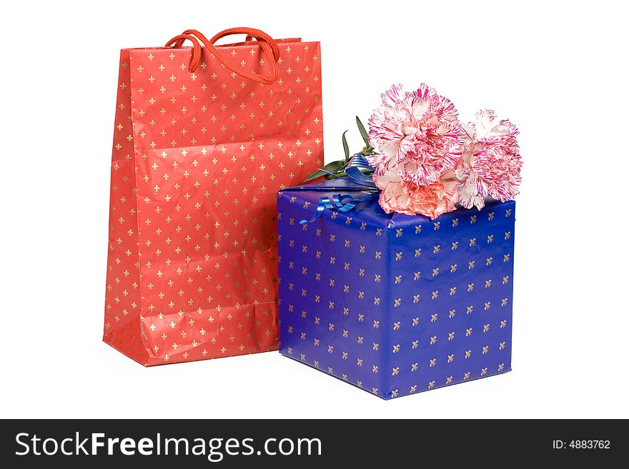 Gifts and flowers isolated on a white background. Clipping path included. Gifts and flowers isolated on a white background. Clipping path included.