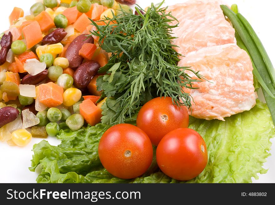 Stake from a salmon with vegetables on a plate