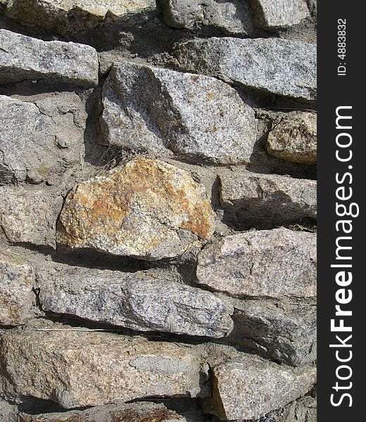 Wall from the stones fastened by cement