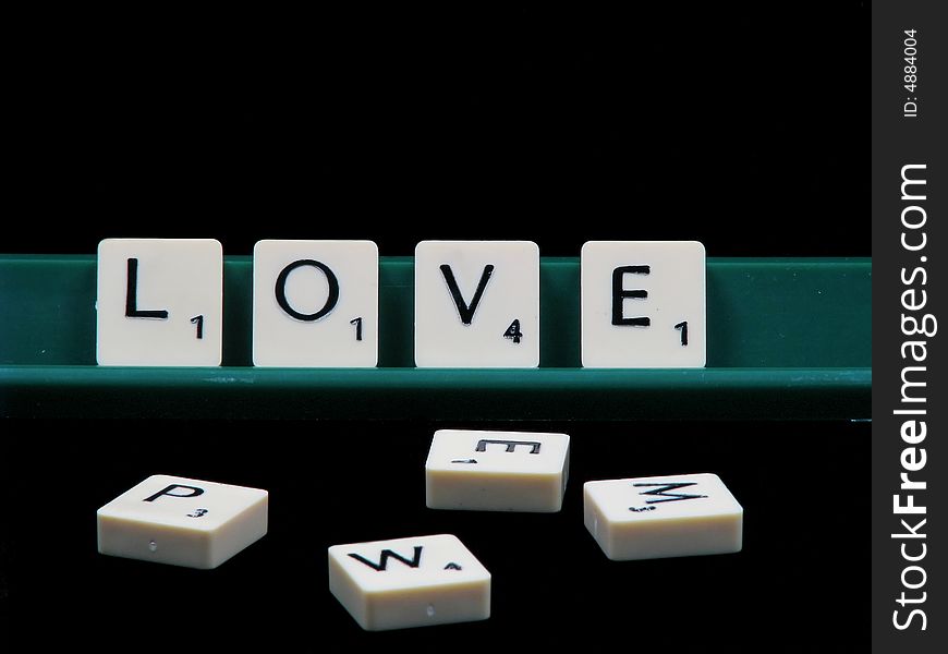 Letters spelling love with a black backround. Letters spelling love with a black backround