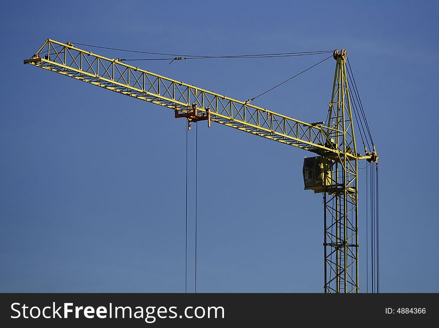 Building yellow crane in the sky. Building yellow crane in the sky