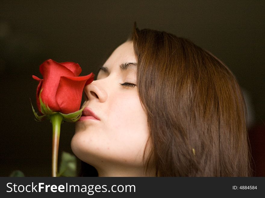 Pretty woman with a red rose. Pretty woman with a red rose