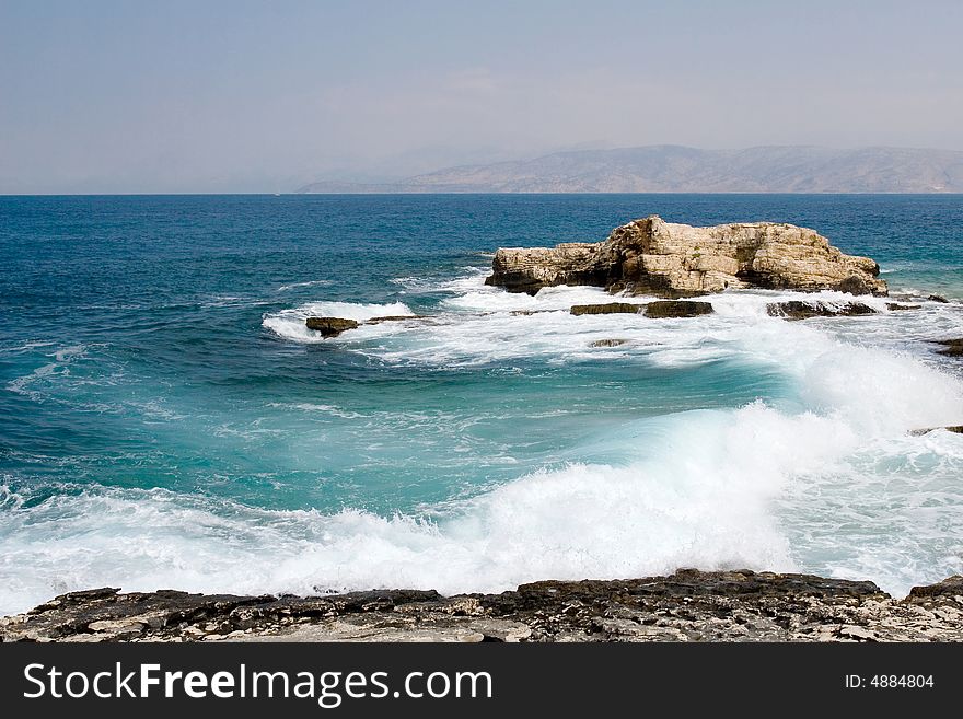 Sea waves dancing near Corfu island shore. Sea waves dancing near Corfu island shore