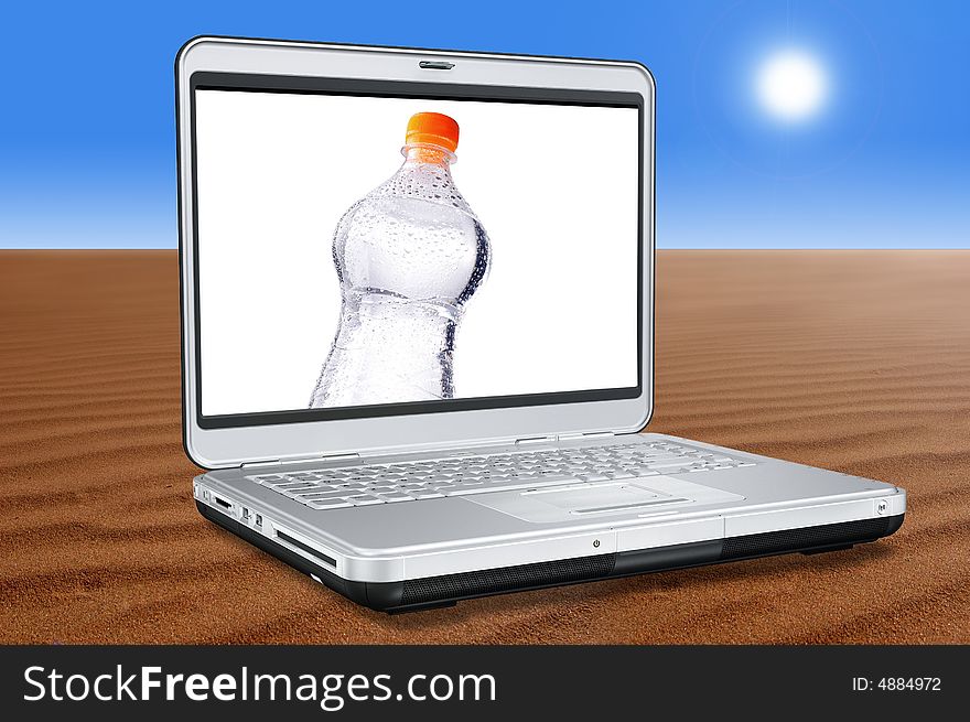 Laptop Computer with water bottle on screen in the Desert