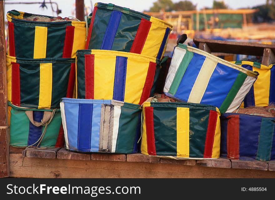 Many colorful baskets for fishing nets in a river