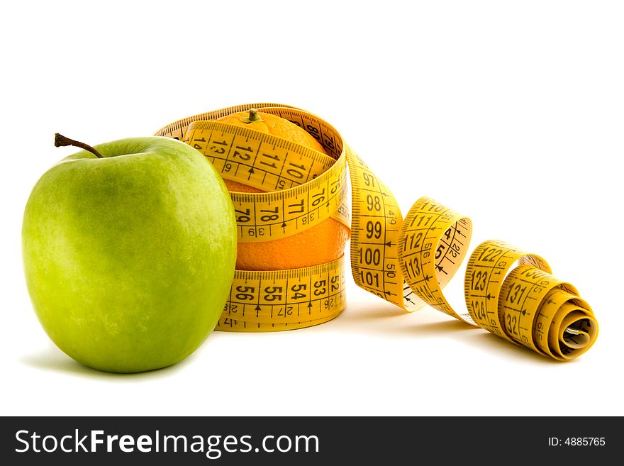 Green apple and an apple in the measuring tape. Green apple and an apple in the measuring tape