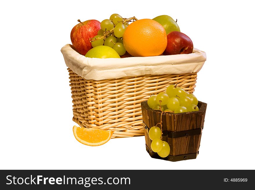 A basket full of fruits and grape. A basket full of fruits and grape