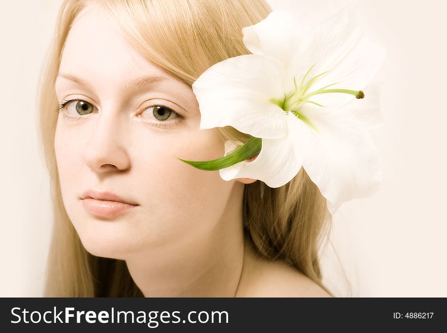 Young woman with white lily