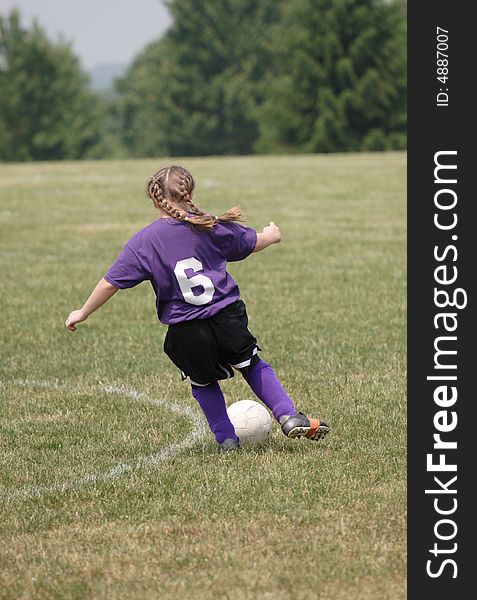 Youth Teen Soccer Player in Action during game. Youth Teen Soccer Player in Action during game.