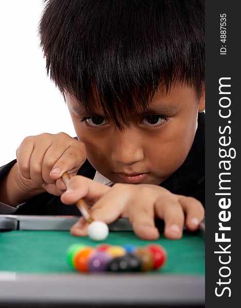 Attractive man concentrating at a pool playing billiards