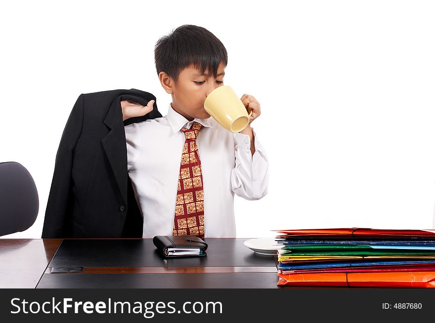 Young businessman holding a black suit is drinking coffee