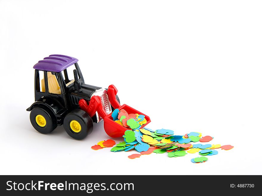 Toy tractor with coloured paper apples. Toy tractor with coloured paper apples
