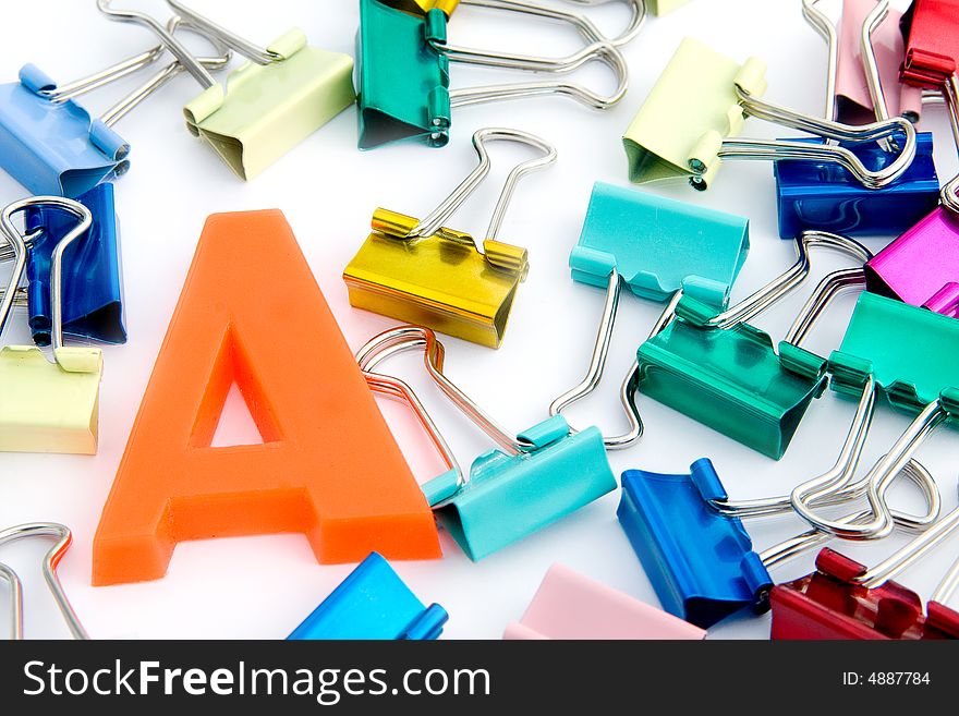 A letter with assorted coloured metal clips. A letter with assorted coloured metal clips
