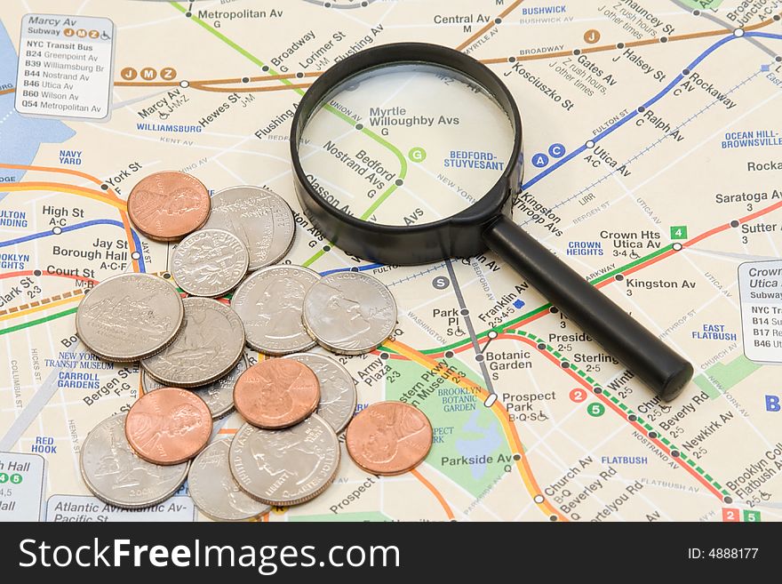 The map, coins and magnifier. The map, coins and magnifier