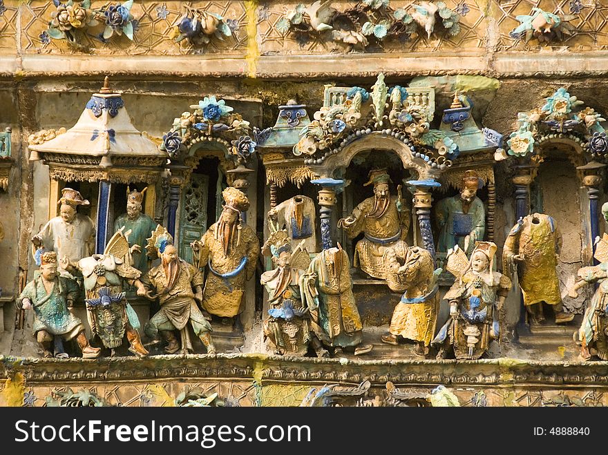 Chinese temple carvings with little statues