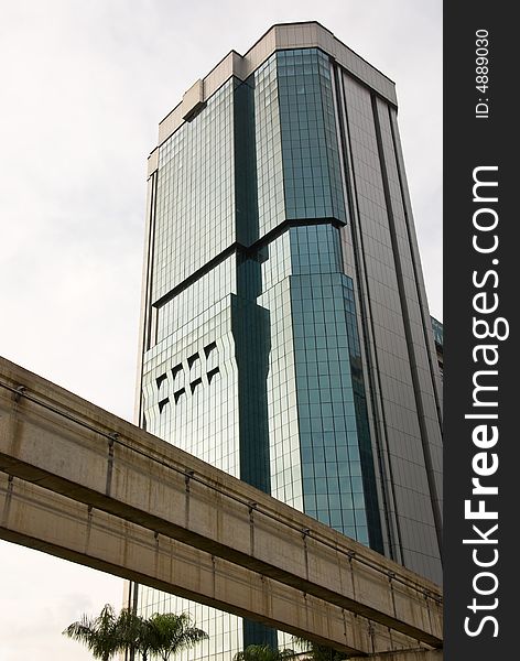 Modern skyscraper with a monorail track