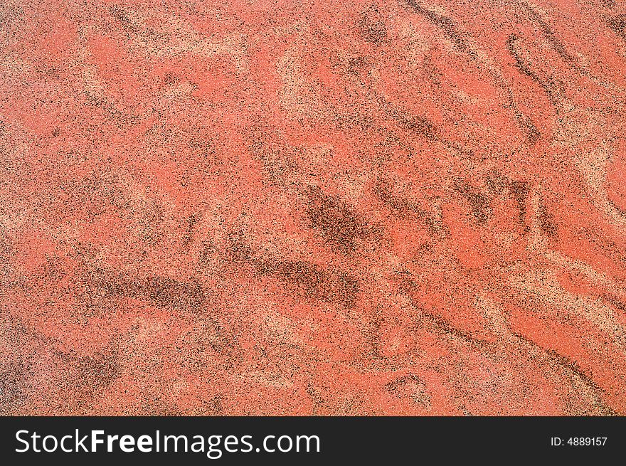 Red sand particular background/texture. Red sand particular background/texture.