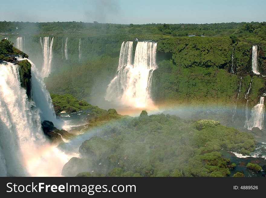 Argentinian and Brazilian Iguazu Falls with a rainbow. Argentinian and Brazilian Iguazu Falls with a rainbow