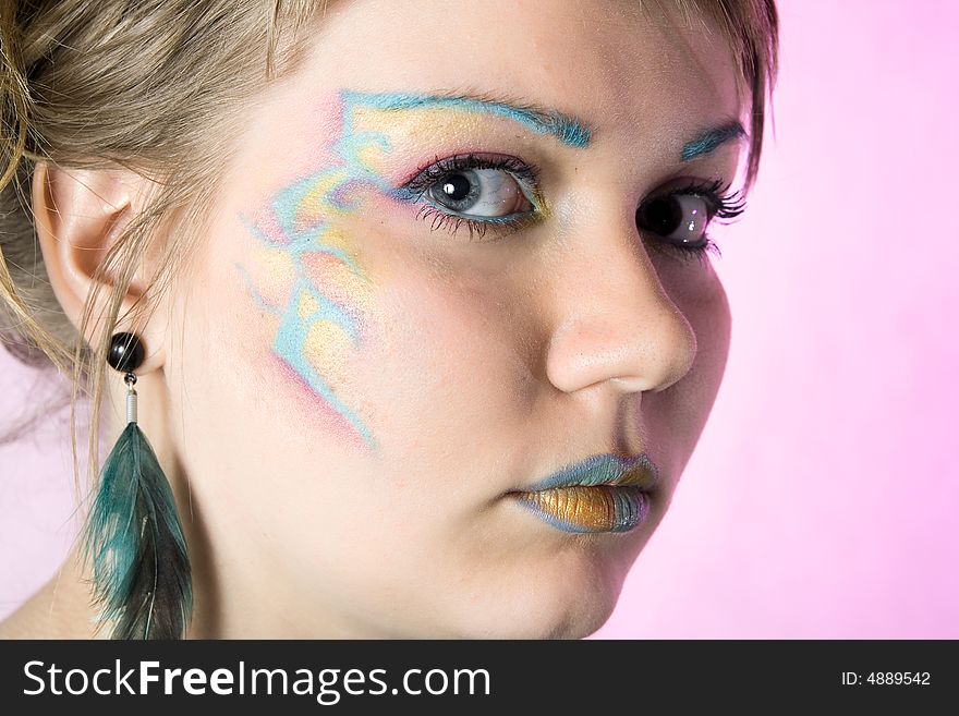 Portrait of young woman with unusual make-up