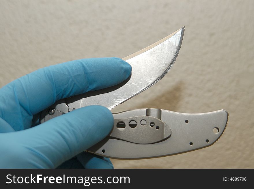 Pocket knife collected by police at the scene of the crime. Pocket knife collected by police at the scene of the crime.