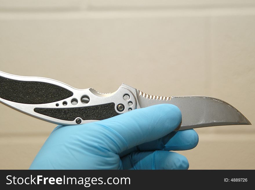 Pocket knife collected by police at the scene of the crime. Pocket knife collected by police at the scene of the crime.