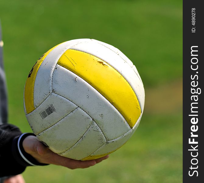 A woman holding a volley ball