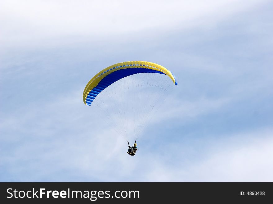 Alone up in the sky while paragliding. Alone up in the sky while paragliding