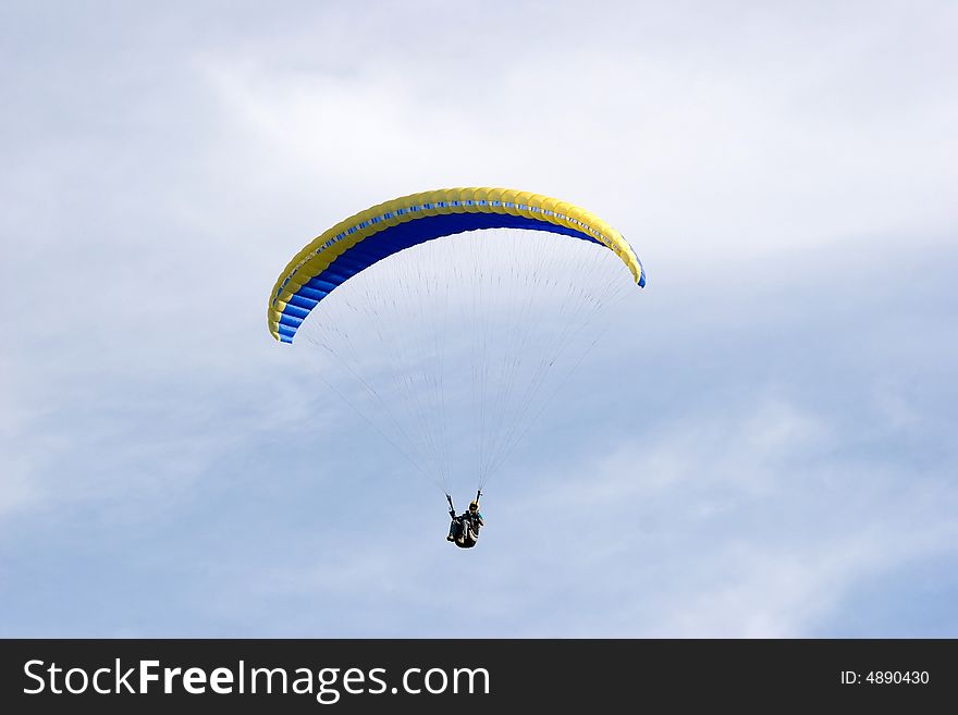 Alone up in the sky while paragliding. Alone up in the sky while paragliding