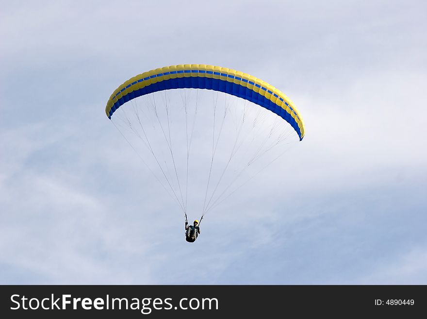 Alone up in the sky while paragliding. Alone up in the sky while paragliding