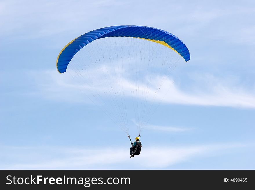 Alone up in the sky while paragliding. Alone up in the sky while paragliding