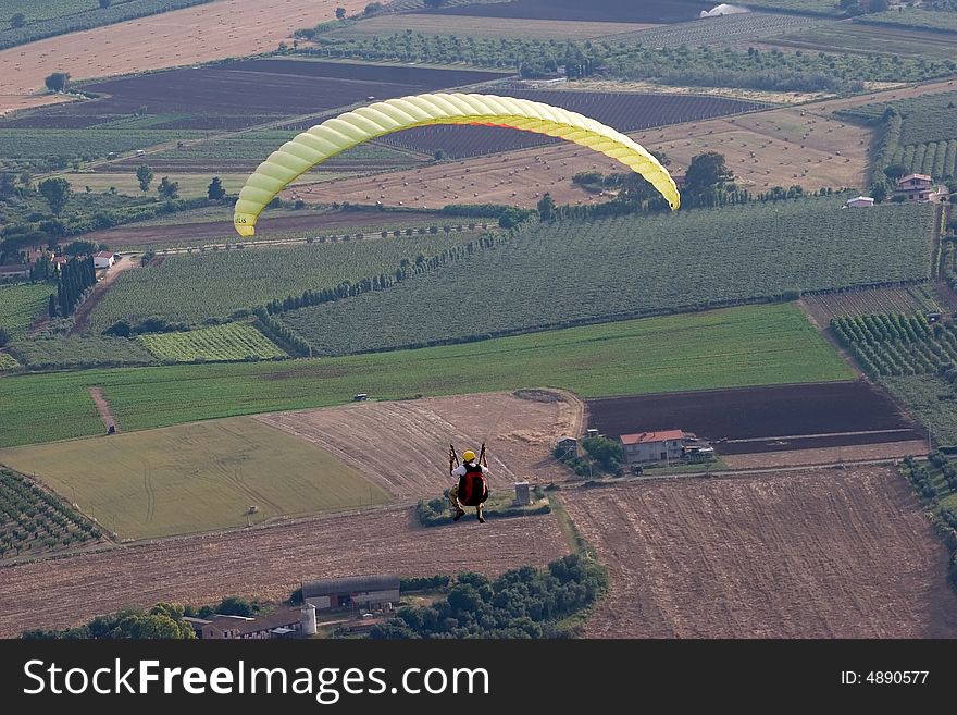 Alone over the plains while paragliding. Alone over the plains while paragliding