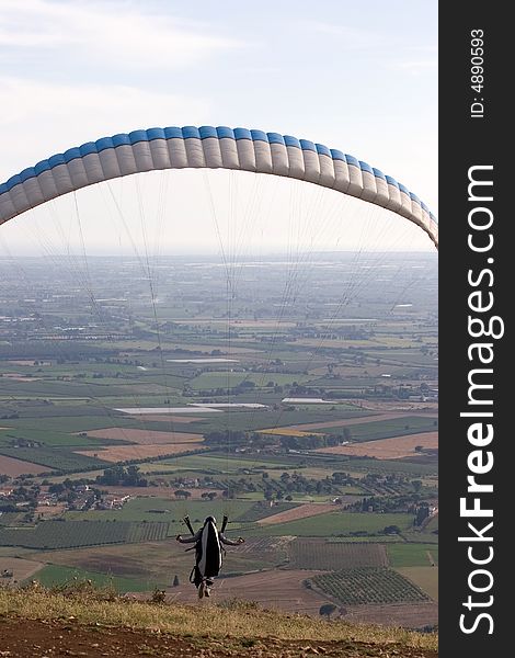 Alone over the plains while paragliding. Alone over the plains while paragliding