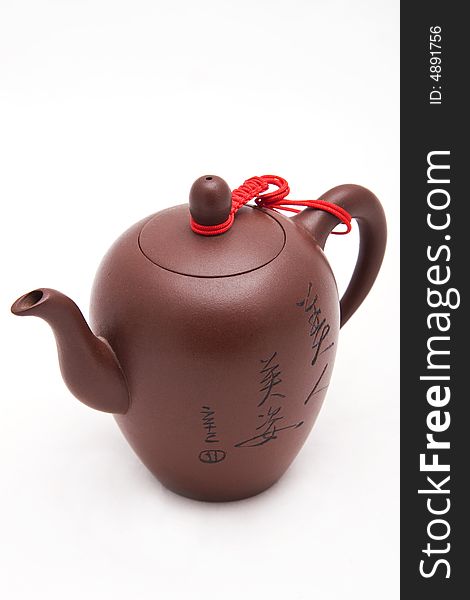 Brown solemnity teapot with hieroglyphs without a background