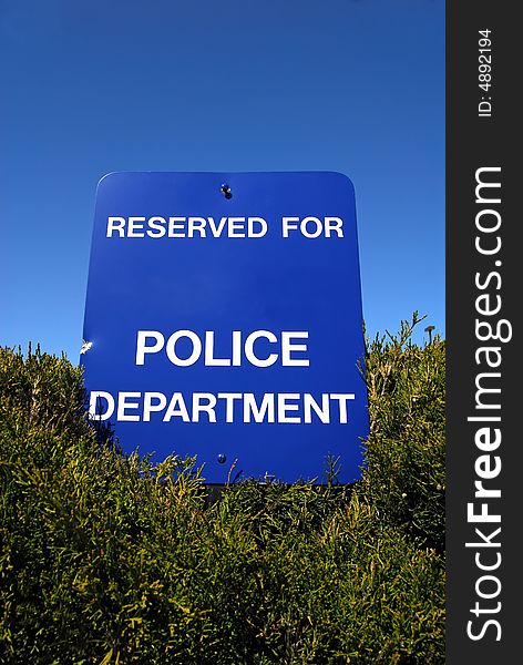 Blue reservation sign for police parking. Blue reservation sign for police parking.