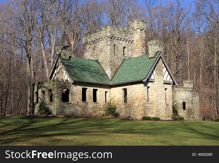 Stone castle on the edge of the woods