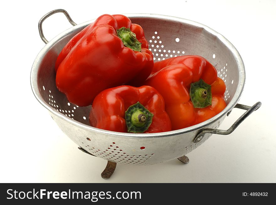 Red peppers in a colander