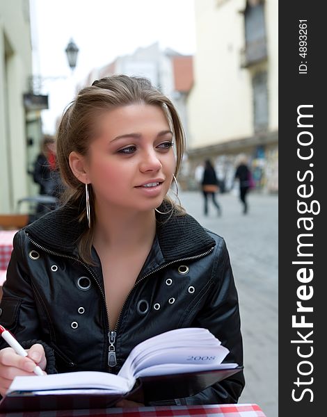 The female student in cafe street in old city. The female student in cafe street in old city