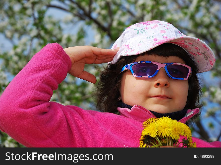 Patriotic child on blossoming tree background. Patriotic child on blossoming tree background