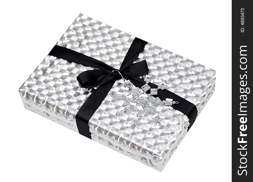 Gift box wrapped in metallic paper on white. Gift box wrapped in metallic paper on white