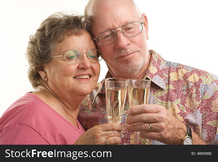 Happy Senior Couple toast with Champagne glasses. Happy Senior Couple toast with Champagne glasses.