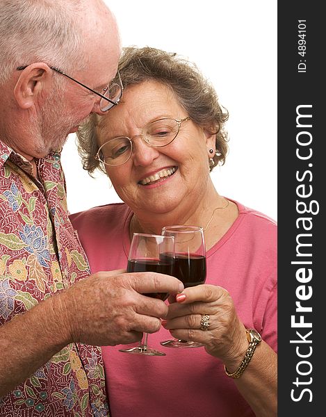 Happy Senior Couple toasting with Wine glasses.