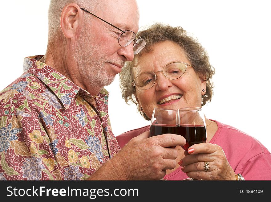 Happy Senior Couple toasting with Wine glasses.