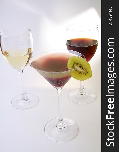 Glasses with white and red wine and layered cocktail. Glasses with white and red wine and layered cocktail