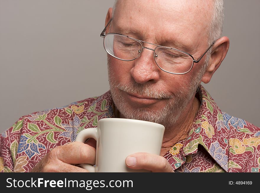Senior Man Enjoys a Cup of Coffee. Senior Man Enjoys a Cup of Coffee