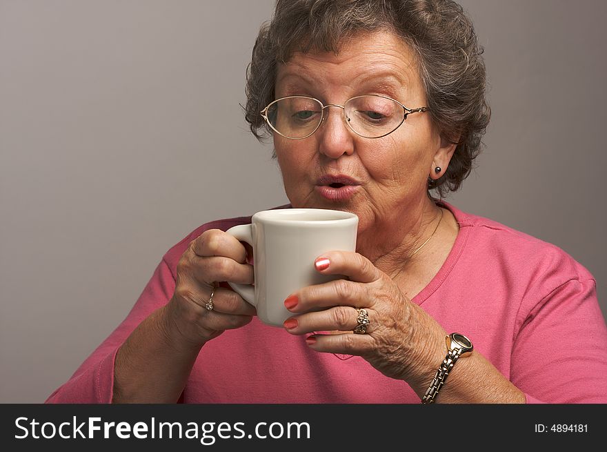 Grandma Enjoys a Cup of Coffee. Grandma Enjoys a Cup of Coffee