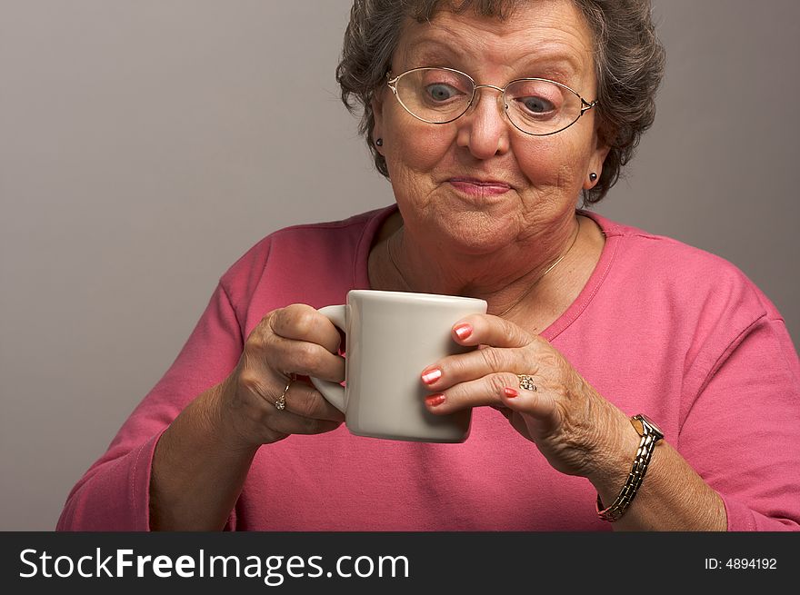 Senior Woman Enjoys Some Coffee